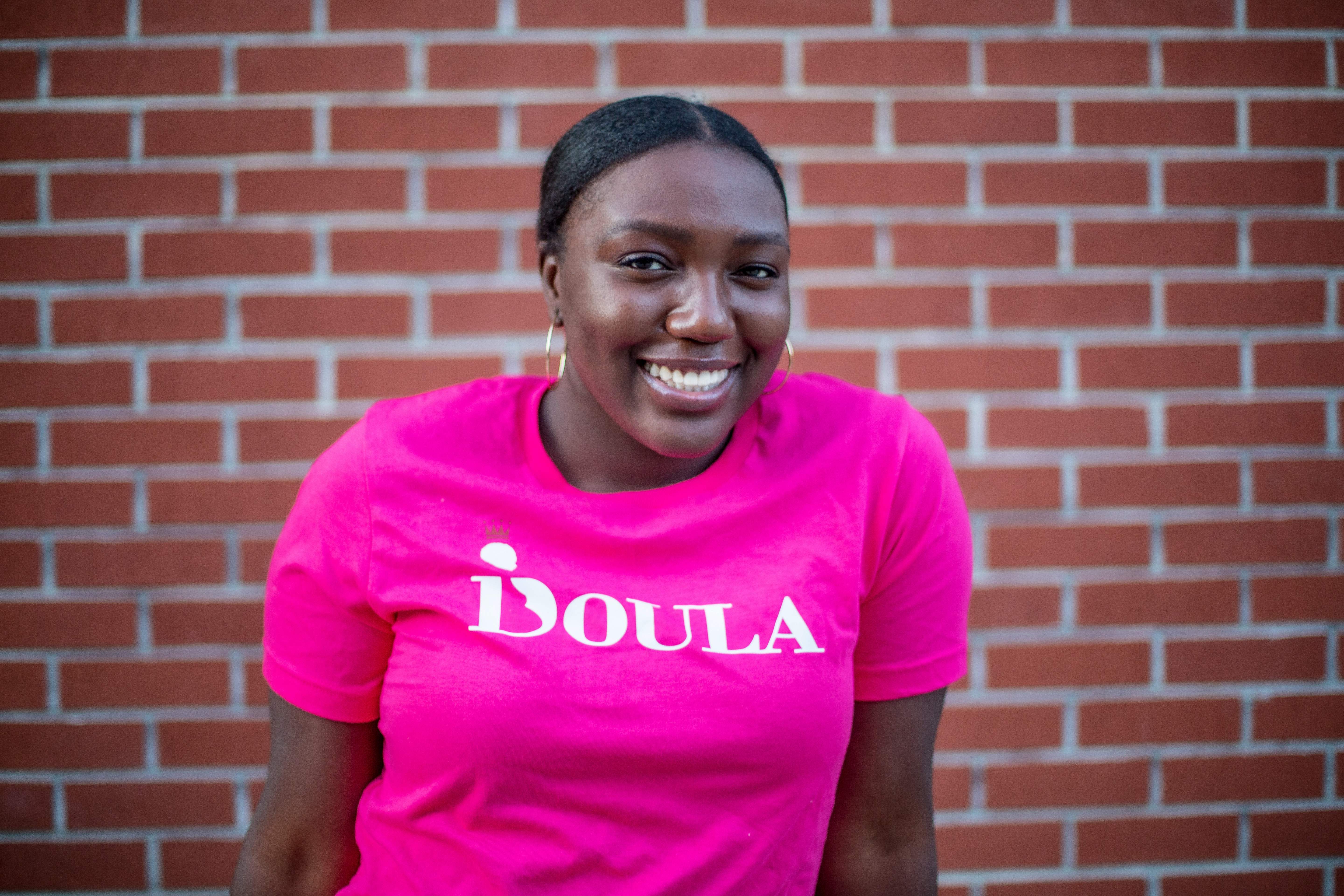 Crystal in a pink doula shirt